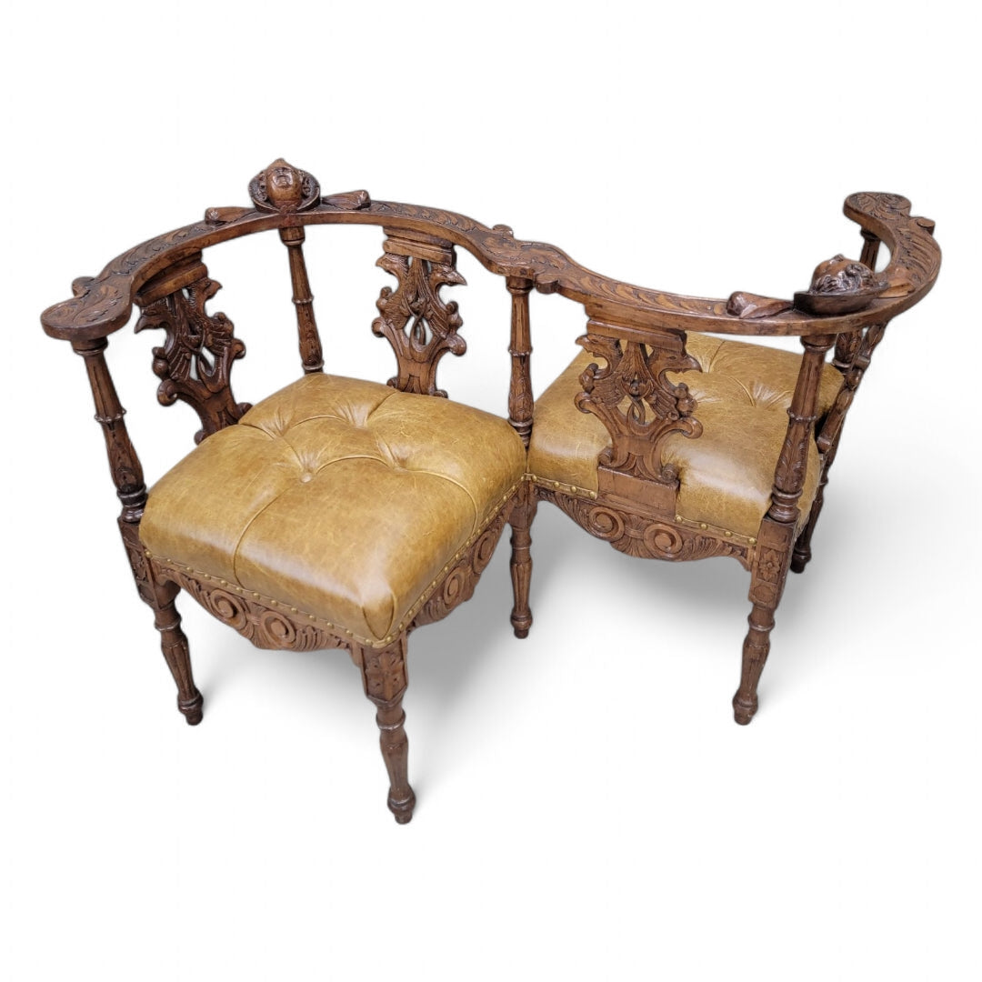Antique Italian Renaissance Revival Ornate Carved Figural Tufted Tete-a-Tete Bench Newly Reupholstered in Leather