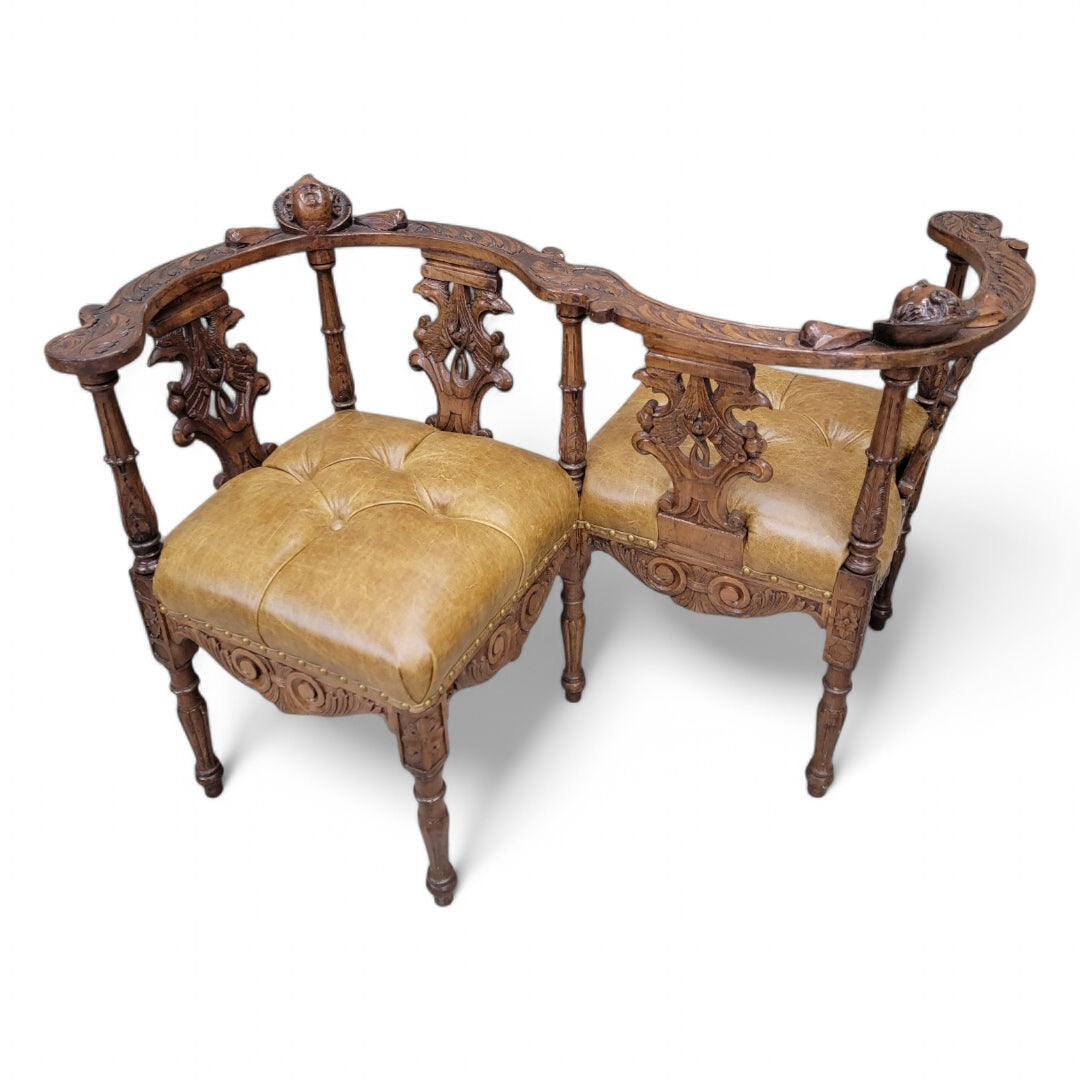 Antique Italian Renaissance Revival Ornate Carved Figural Tufted Tete-a-Tete Bench Newly Reupholstered in Leather