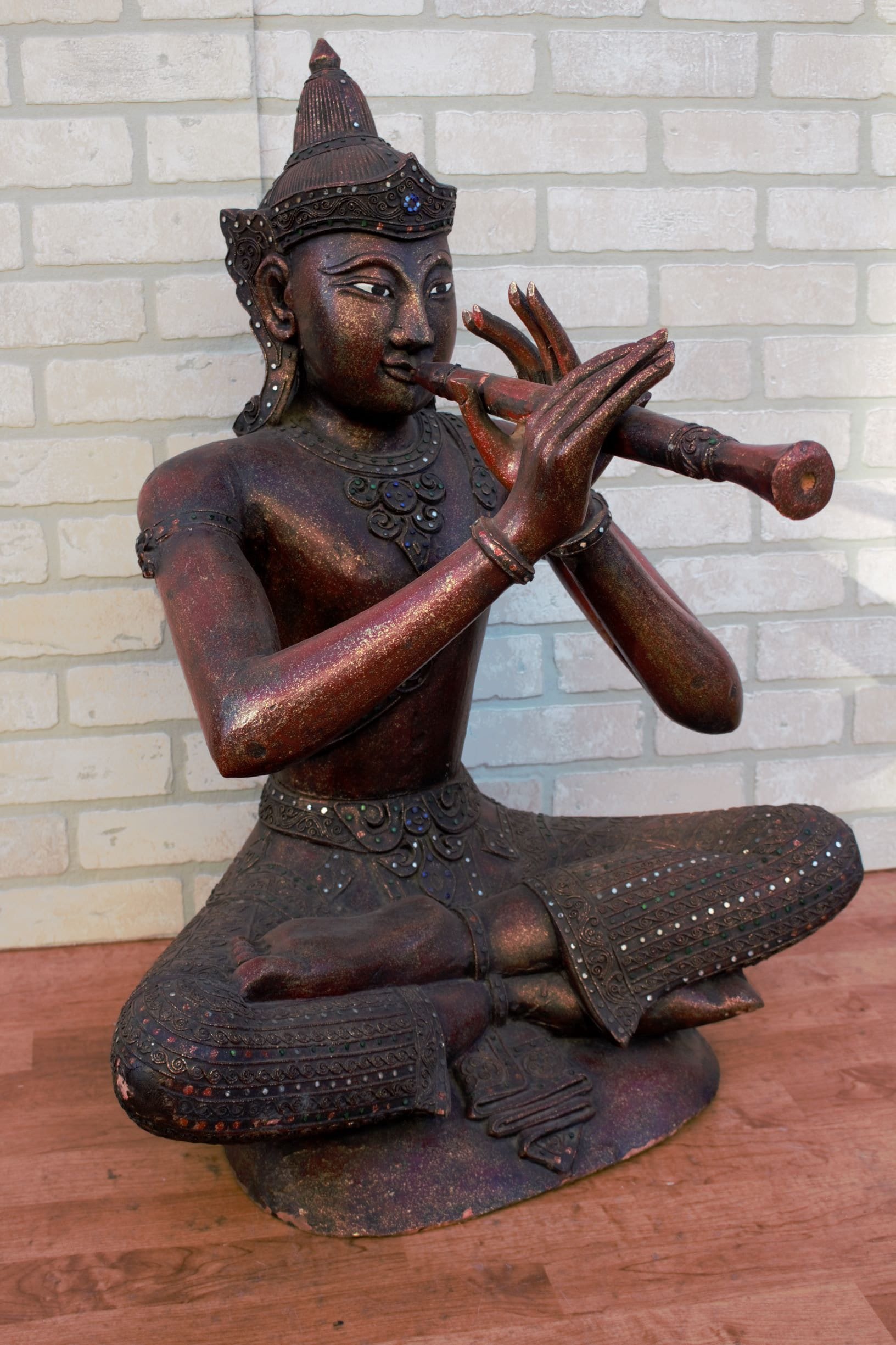 Antique Thai Carved Seated Buddha Playing a Flute