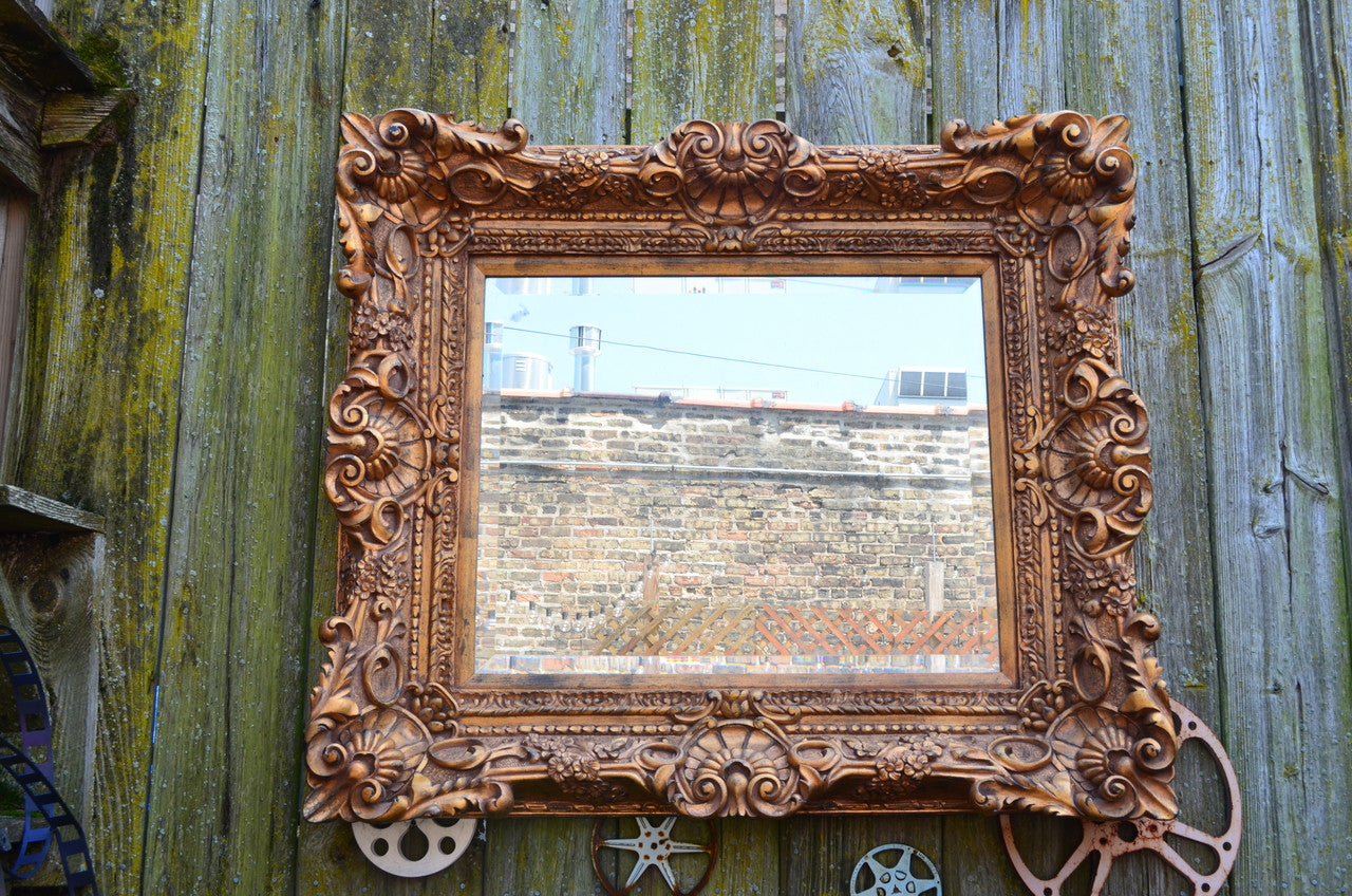 Adding a Touch of History: Vintage Grind House's Antique Gold Ornate Victorian Mirror