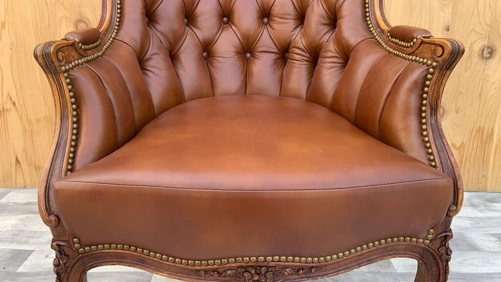 Antique French Provincial Hand Carved Walnut Bergere Chair Newly Upholstered In Full-Grain "Whiskey" Tufted Italian Leather