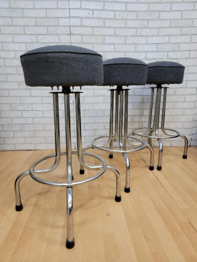 Vintage Industrial Swivel Bar Stools Newly Upholstered in a Charcoal Wool - 3 Piece Set